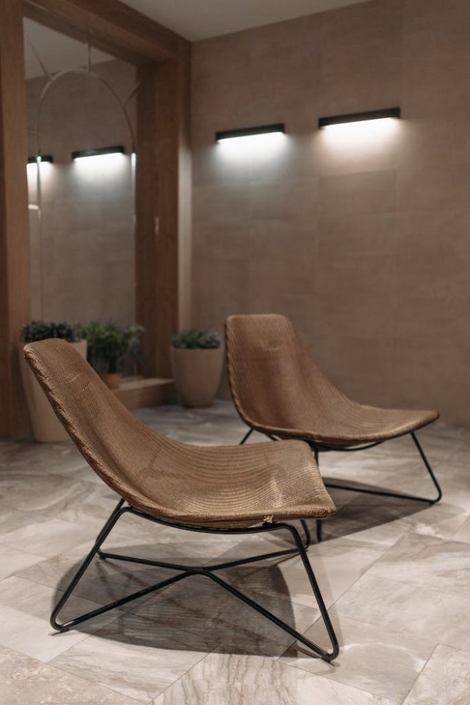 Cozy minimalist room featuring modern chairs with sleek design in a serene setting.